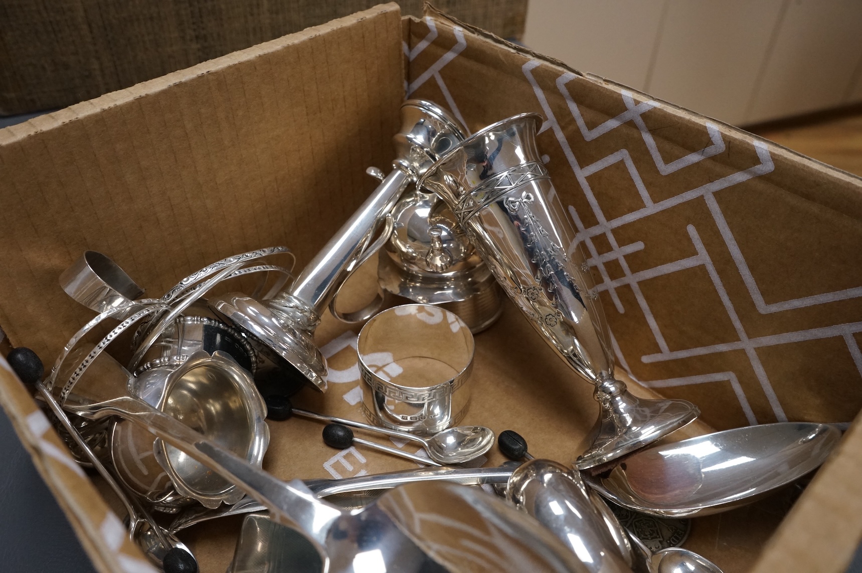 A collection of small silver including an Edwardian Art Nouveau tri-handled pedestal bowl, Birmingham, 1909, height 90mm, a sugar bowl, three cigarette cases, goblet, communion jug, five condiments, three napkin rings, e
